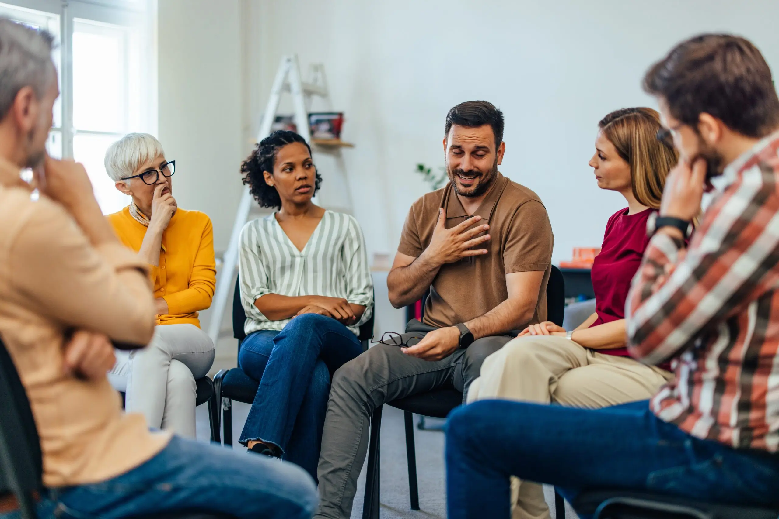 National Family Caregivers Month Emotional Man Sharing During Group Therapy